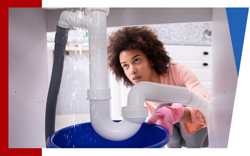 image of a woman with a plumbing emergency