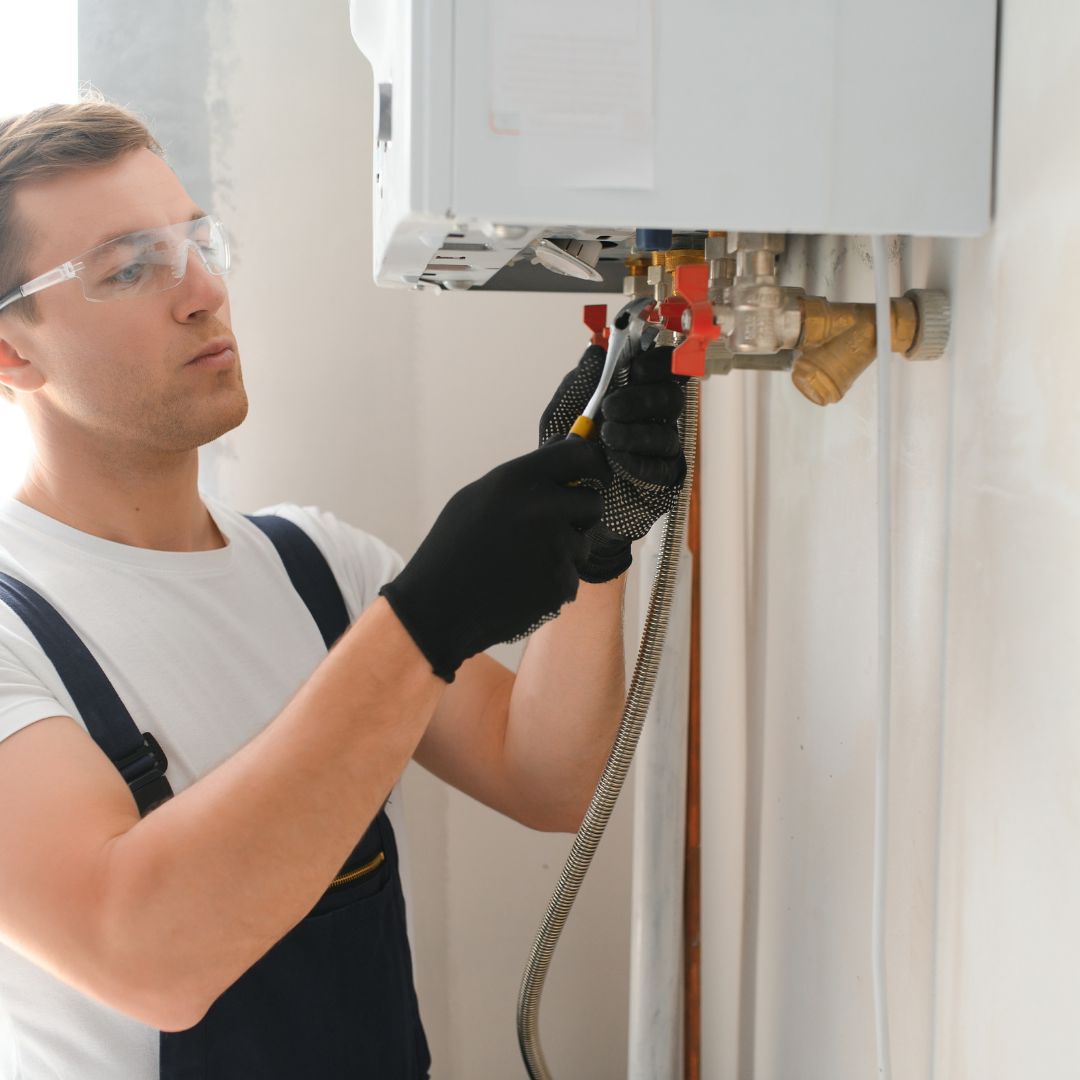 a plumber working on a water heater