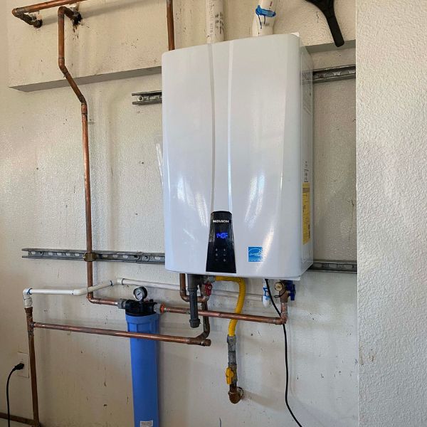A tankless water heater mounted to a wall
